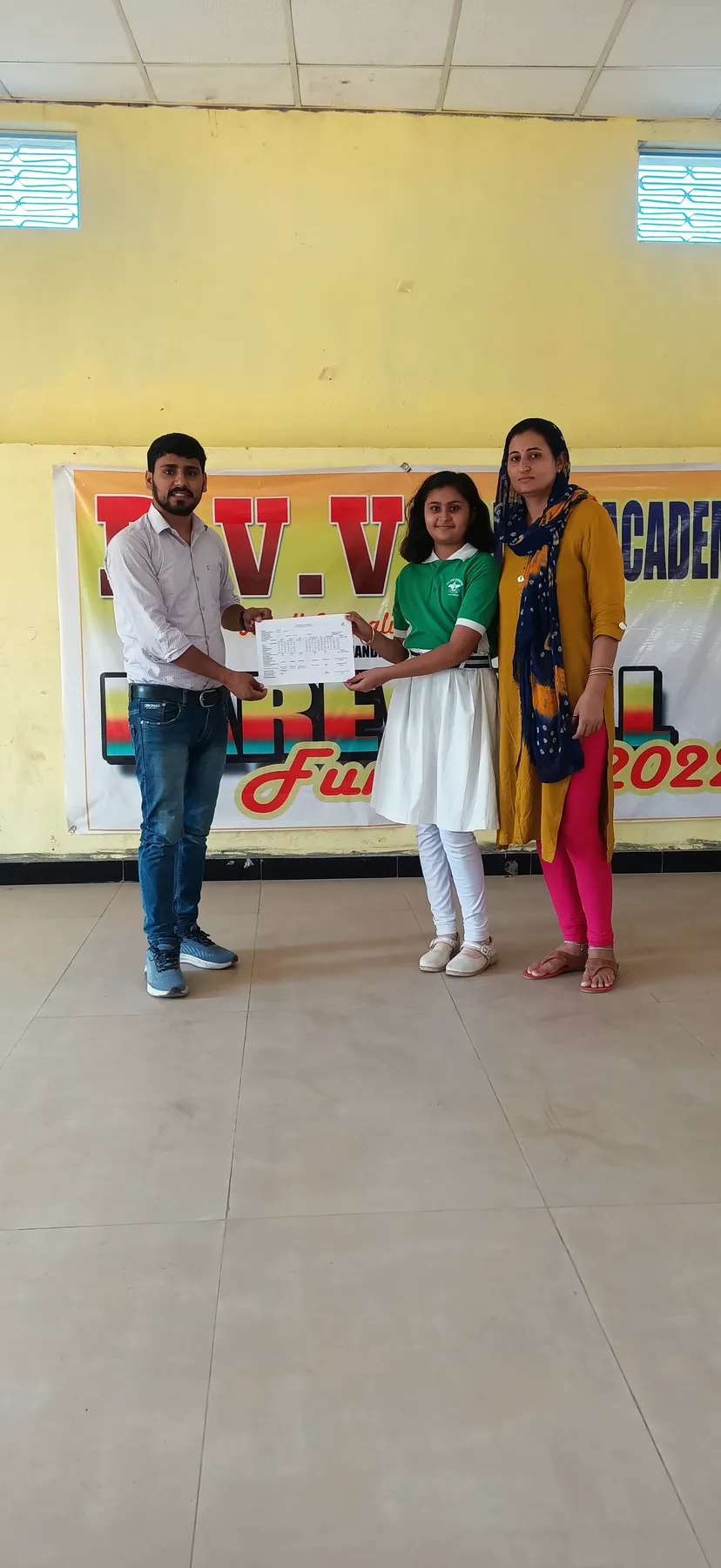 A young student receives her prize