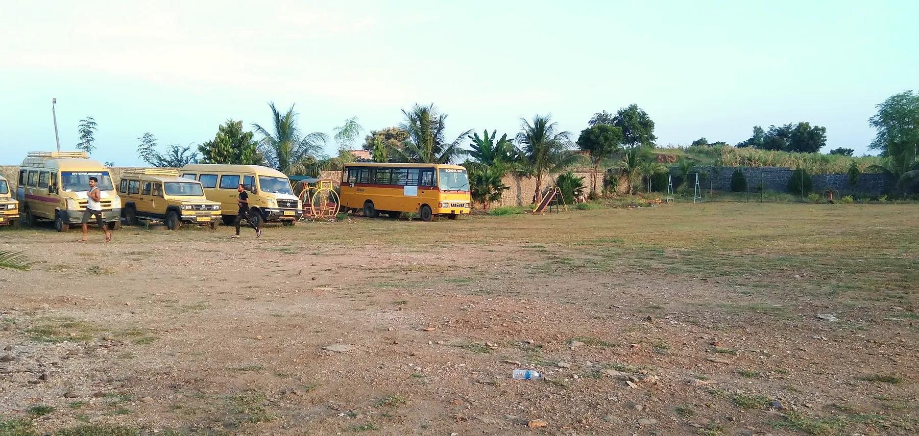 School buses parked by the ground