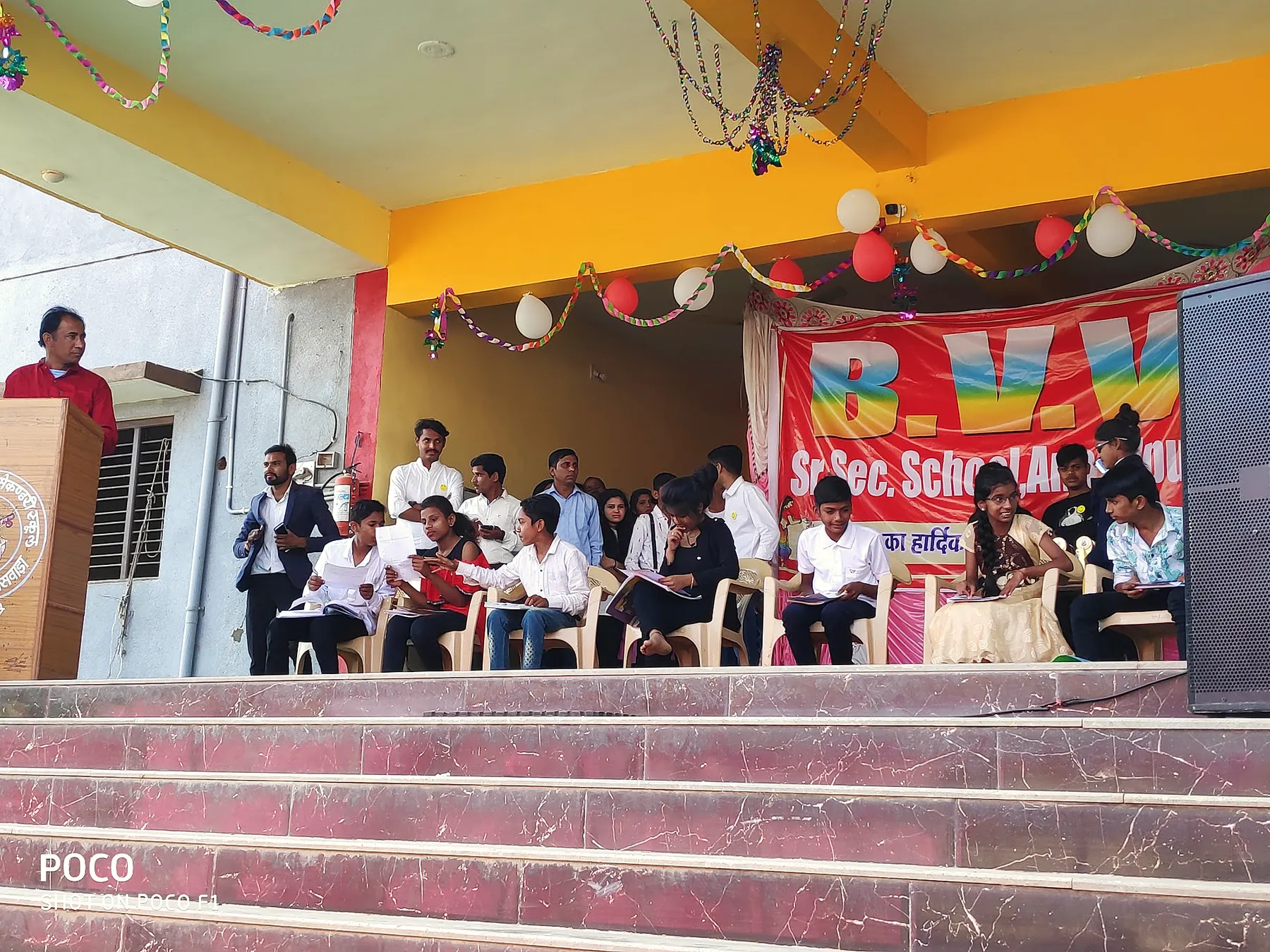 Guests on stage at a programme