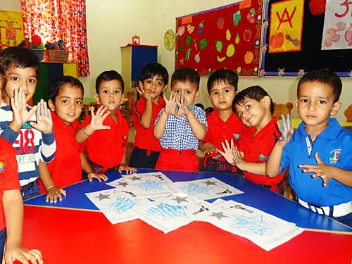 KG students showing their artwork